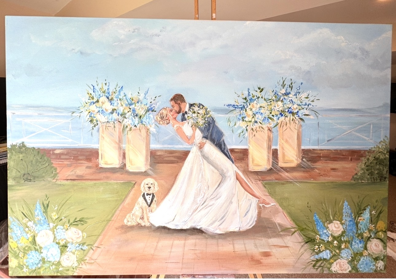 Finished live wedding painting showing a couple kissing at the ceremony with floral arrangements and their dog